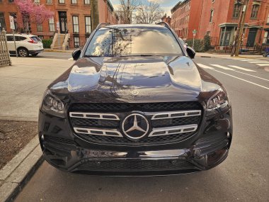 New York City, USA - March 18, 2024: Mercedes Benz GLS 580 luxury car vehicle outside, front view. clipart