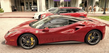 Miami Beach, Florida USA - April 18, 2021: red Ferrari 488 GTB, side view. clipart