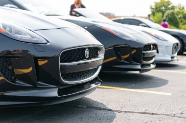 Chicago, Illinois, USA - September 08, 2024: Jaguar F-TYPE S v8 AWD Convertible vehicle, front view. Modern Jaguar F-TYPE S v8 AWD Convertible car black color. F-TYPE R75 AWD Convertible car. F-TYPE S clipart