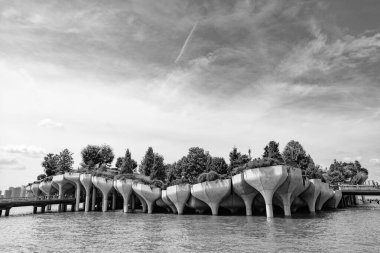 New York City, USA - August 05, 2023: Little Island is floating park on Hudson river next to Manhattan with modern architecture. clipart