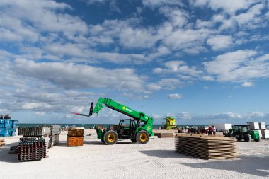 Miami, Florida, USA - November 16, 2024: Boom lift outdoor. Machine equipment. Heavy crane equipment. Boom lifting machinery. Lift machine crane at building site. Telescopic Boom Lift, Sunbelt. clipart