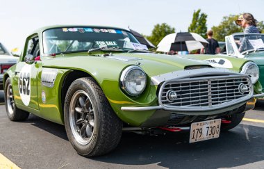 Chicago, Illinois, USA - September 08, 2024: Triumph tr4 retro sport car, front view. Retro car. Green classic triumph tr4. Triumph tr4 at Chicago clipart