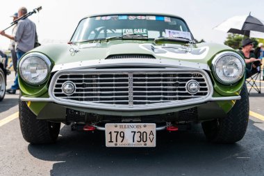 Chicago, Illinois, USA - September 08, 2024: Triumph tr4 retro sport car, front view. Retro car. Green classic triumph tr4. Triumph tr4 at Chicago clipart