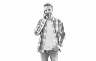 cheerful casual man answer phone call in studio. man having phone call wearing checkered shirt. photo of man has phone call communication. man has phone call isolated on white background.