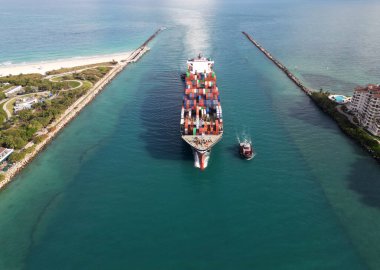 Cargo ship vessel leaving port. Container ship. Export and import. Cargo business. Port of Miami. Cargo ship with container in Miami. Freight container on cargo vessel. Shipping container stacks. clipart