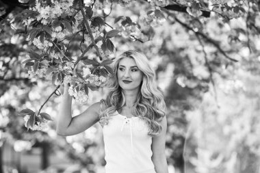 Forever young and free. spring blossoming tree. pink cherry tree flowers. floral aroma treatment. vintage and retro fashion. pure beauty female. carefree and happy woman. sexy girl enjoy sakura bloom.
