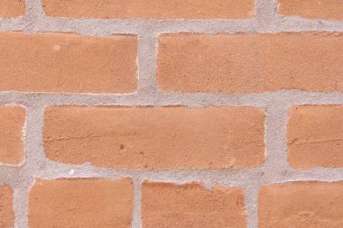 Duvar dokusu arka planı. Tuğla duvar yapısı. Tuğla ustalığı geçmişi. Malzeme konsepti. Tuğla duvarın yüzeyi. Kalıplaşmış kahverengi fon. Şehir tuğla ayarı.