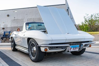 Park Ridge, Illinois, USA - August 21, 2024: Chevy Corvette. Retro convertible car parked at auto show, corner view. Chevrolet Corvette C2 retro car. Convertible car of Chevrolet Corvette C2. clipart