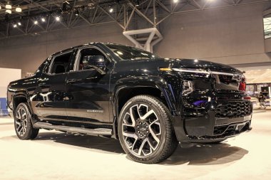 New York City, USA - March 27, 2024: 2024 Chevrolet Silverado EV electric black pickup truck at New York International Auto Show, corner view. clipart