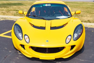 Chicago, Illinois, USA - September 08, 2024: 2005 Lotus Elise sportscar vehicle, front view. Orange convertible sportscar. Modern Lotus Elise car. Lotus Elise at Chicago clipart