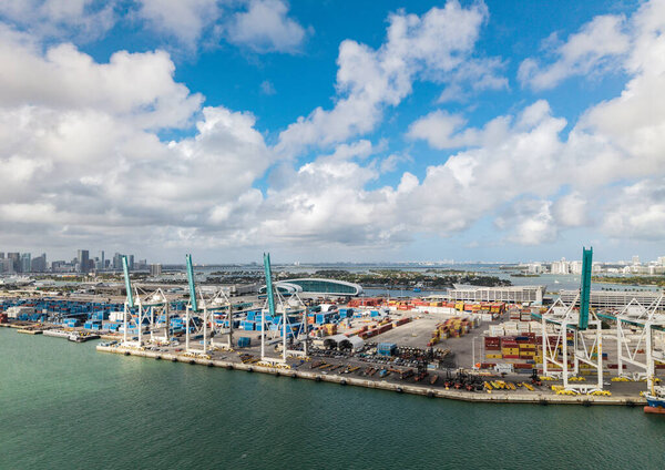 Miami, Florida - February 12, 2025: Aerial Miami port with cargo container. Maritime shipping logistics. Port of Miami. Cargo shipping container in Miami, aerial view. Freight container, maritime.