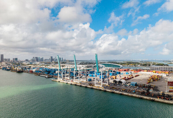 Miami, Florida - February 12, 2025: Port of Miami. Cargo shipping container in Miami, aerial view. Freight container, maritime. Aerial Miami port with cargo container. Maritime shipping.