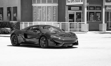 Miami Beach, Florida USA - April 15, 2021: mclaren 570GT MSO Black Collection, front corner view.