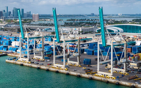 Miami, Florida - February 12, 2025: Freight container, maritime. Aerial Miami port with cargo container. Maritime shipping. Port of Miami. Cargo shipping container in Miami, aerial. Import and export.