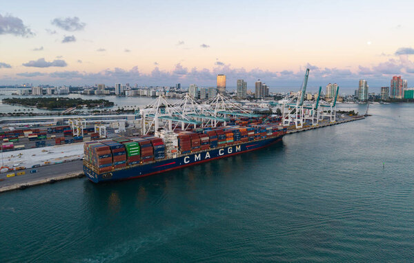 Miami, Florida - February 11, 2025: Export and import. Port of Miami. Cargo ship loaded with container in Miami, aerial. Freight container. Aerial Miami port with cargo container. Cargo delivery.