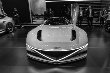 New York City, ABD - 27 Mart 2024: Genesis X Gran Berlinetta Concept supercar Vibrant orange open car at New York International Auto Show, front view.