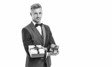 smiling man in tux with business reward box isolated on white.