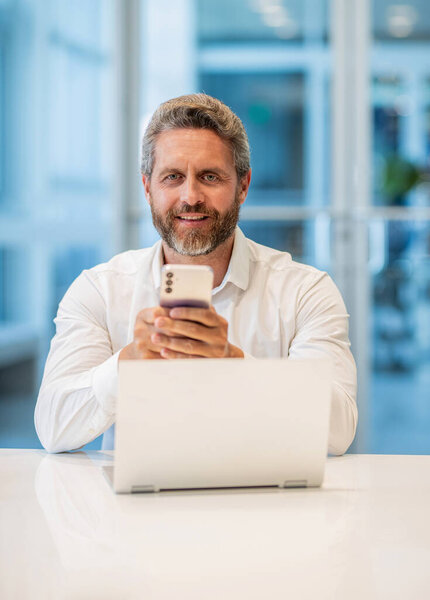 Professional businessman has communication online. Business chat. Hispanic businessman working online. Business success. Office manager man use laptop and phone. Internet surfing.