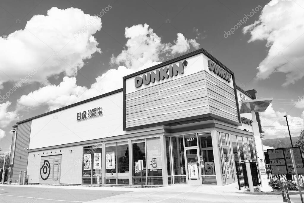 Chicago, USA - August 16, 2024: Combined Dunkin Donuts and Baskin Robbins cafe. Corner view. best ice cream and donuts