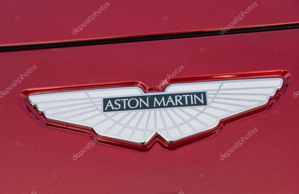 Miami, Florida, USA - April 17, 2025: Luxury crossover car Aston Martin DBX. Car Aston Martin DBX parked outdoor. Red car, logo view. Aston Martin DBX 2021 crossover car.