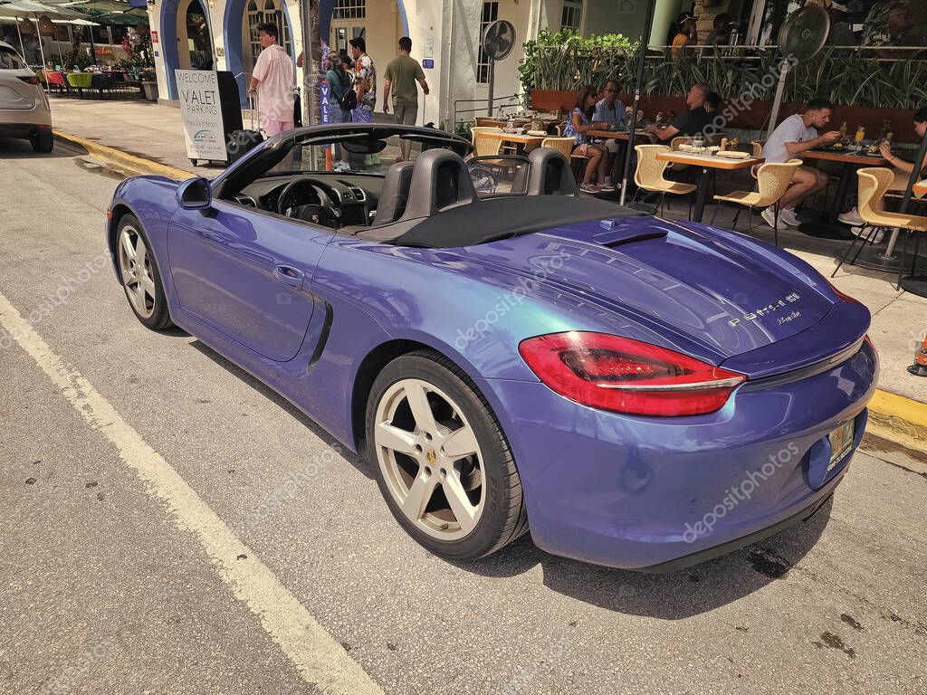 Miami Beach, Florida USA - June 8, 2024: 2018 Porsche 718 Boxter blue color at miami beach. luxury car porshche at ocean drive Miami beach. side view