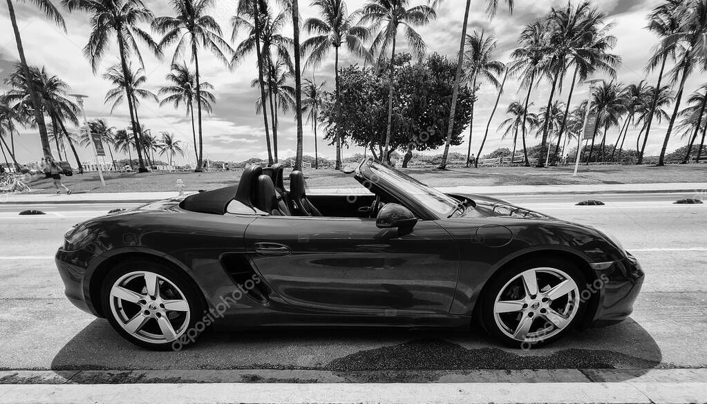 Miami Beach, Florida USA - June 8, 2024: 2018 Porsche 718 Boxter blue color at miami beach. luxury car porshche at ocean drive Miami beach. side view