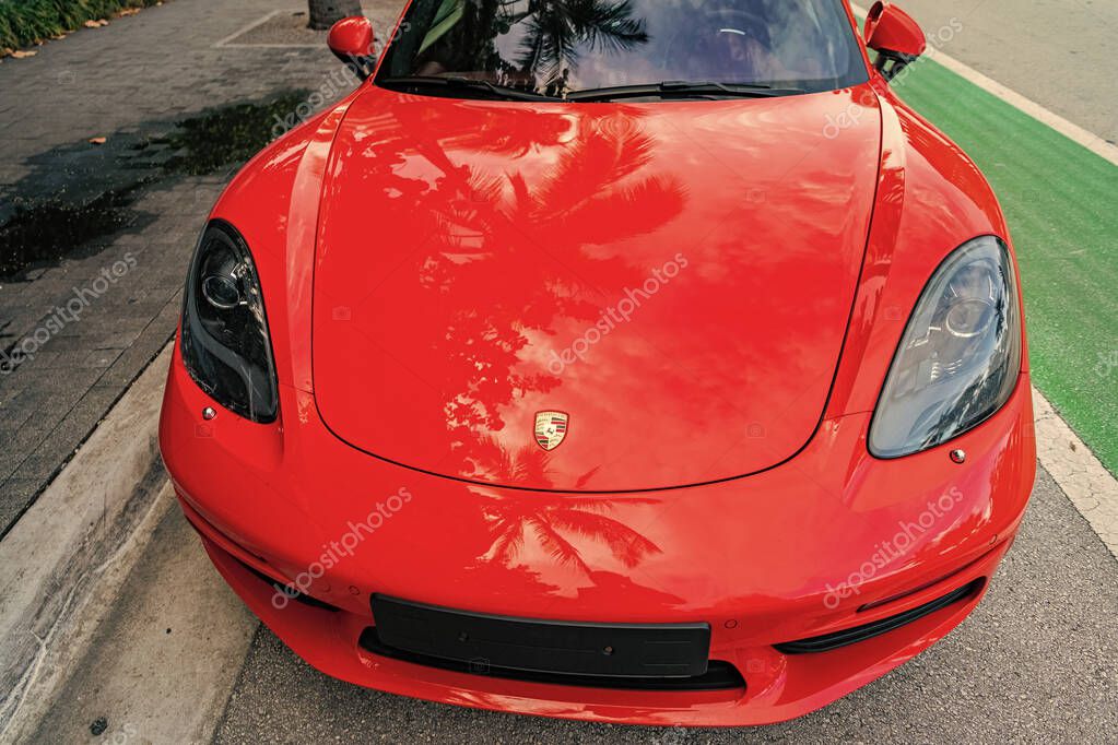 Miami Beach, Florida USA - June 9, 2024: 2018 Porsche 718 Boxter s orange color at miami beach. luxury car porshche at ocean drive Miami beach. front view