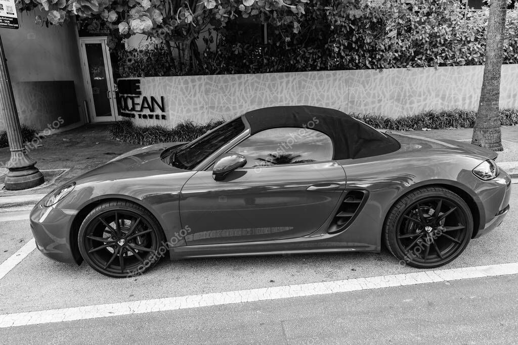 Miami Beach, Florida USA - June 9, 2024: 2018 Porsche 718 Boxter s orange color at miami beach. luxury car porshche at ocean drive Miami beach. side view