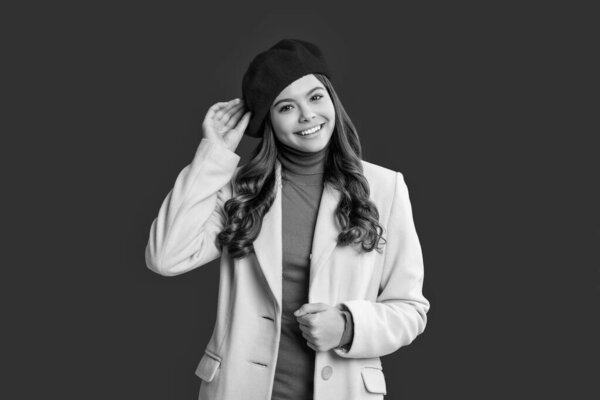 Trendy and stylish teenager girl. Fall fashion style for teen. Complete outfit for fall style. Girl in autumn coat isolated on red. Teen girl wear coat. Autumn fashion girl.