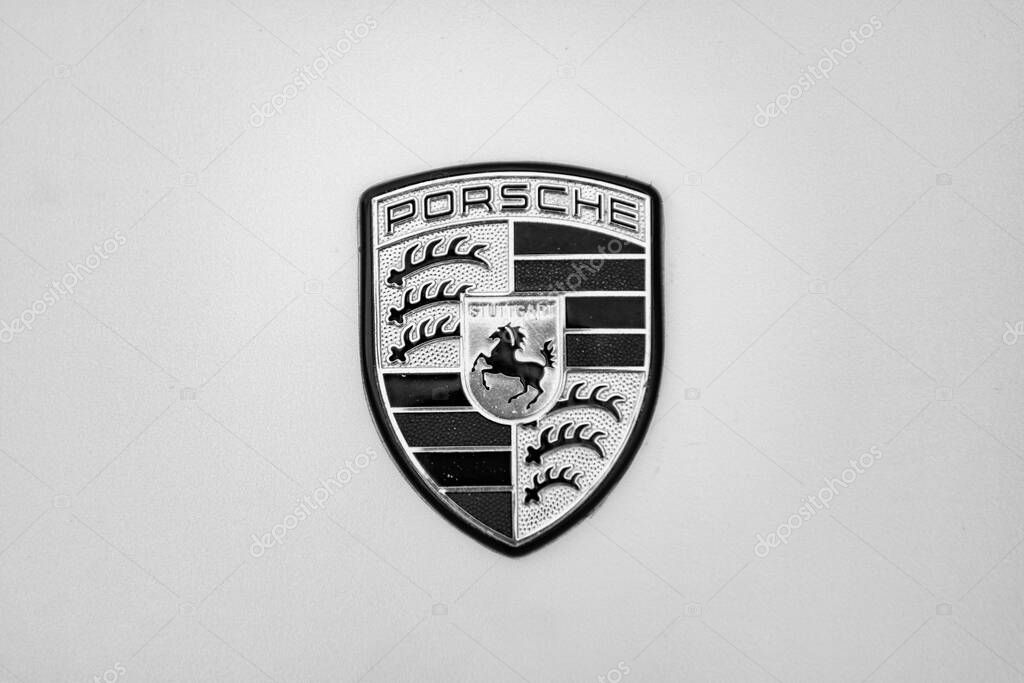 Chicago, Illinois - September 29, 2024: Porsche 911 Carrera S yellow color. Porsche 911 Carrera S parked on the street. Porshche logo