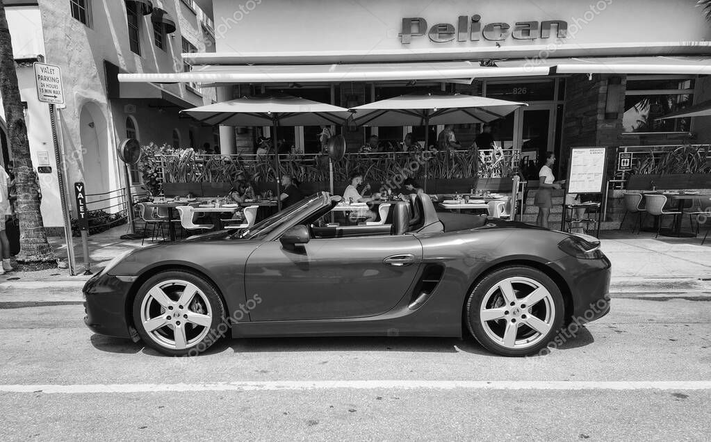 Miami Beach, Florida USA - June 8, 2024: 2018 Porsche 718 Boxter blue color at miami beach. luxury car porshche at ocean drive Miami beach. side view