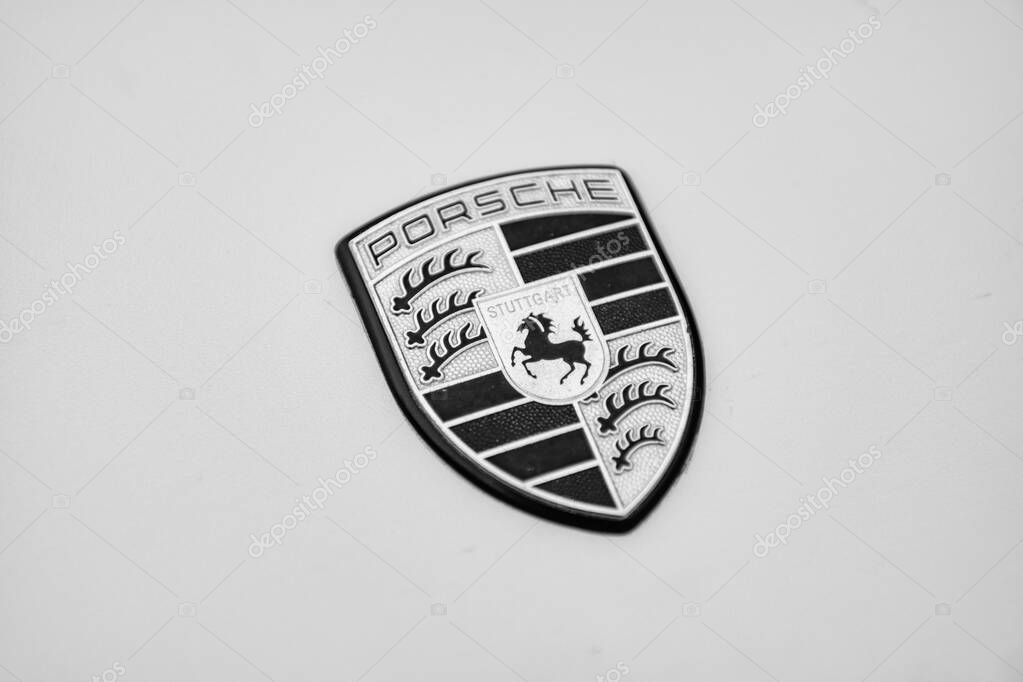 Chicago, Illinois - September 29, 2024: Porsche 911 Carrera S yellow color. Porsche 911 Carrera S parked on the street. Porshche logo