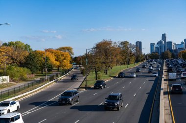 Chicago, Illinois, USA - October 25, 2024: City road full of car. Urban autumn. Urban road way highway. Car traffic on autumn road highway. City destination highway. Fall season. Road way with car.