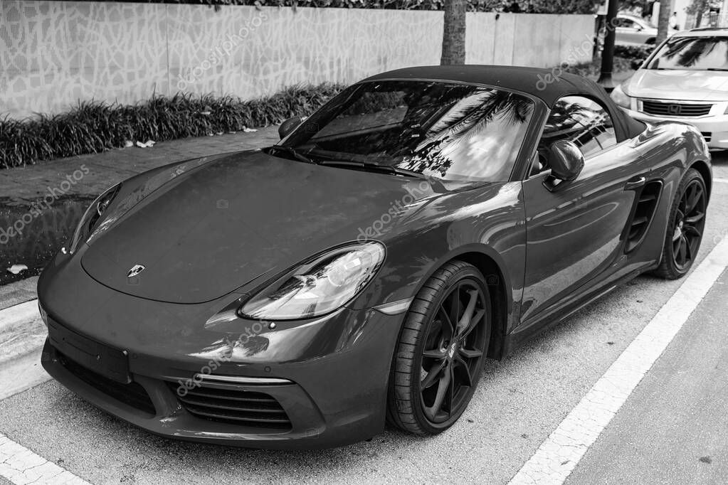 Miami Beach, Florida USA - June 9, 2024: 2018 Porsche 718 Boxter s orange color at miami beach. luxury car porshche at ocean drive Miami beach. front corner view