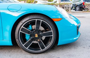 Miami, Florida, USA - February 16, 2025: Blue car, wheelview. 2017 Porsche 911 Carrera S sport car. Luxury car Porsche 911 Carrera S. Car Porsche 911 Carrera S parked outdoor.