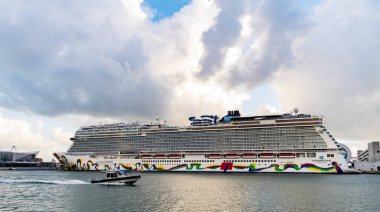 Miami, Florida, USA - November 04, 2024: Norwegian cruise line. Cruise ship tour and travel at sea. Ship vessel casting off. Norwegian Encore cruise ship voyage. Cruise in summer vacation.