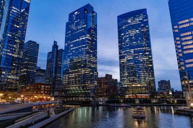City night illuminated building. Skyscraper cityscape. Night city of Chicago. Business city. Night cityscape of Chicago skyscraper building. Chicago architecture of skyscraper. Urban nightscape.