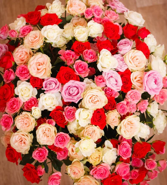 A bouquet of roses. A big bouquet of flowers. Multicolored roses. Delicate wedding bouquet.