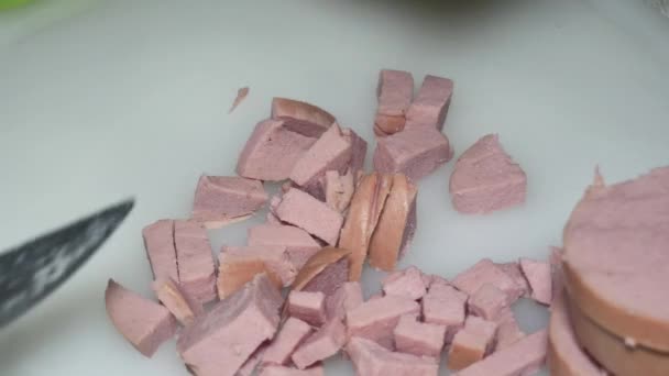 Hand Knife Cuts Boiled Sausage Cubes — Stockvideo