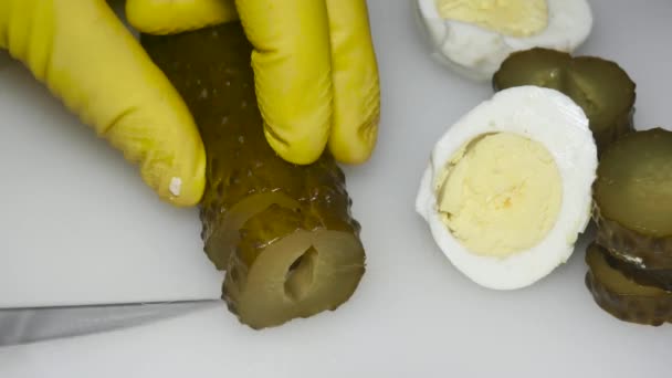 Hand Knife Cuts Pickled Cucumber Close Next Boiled Eggs — Vídeos de Stock