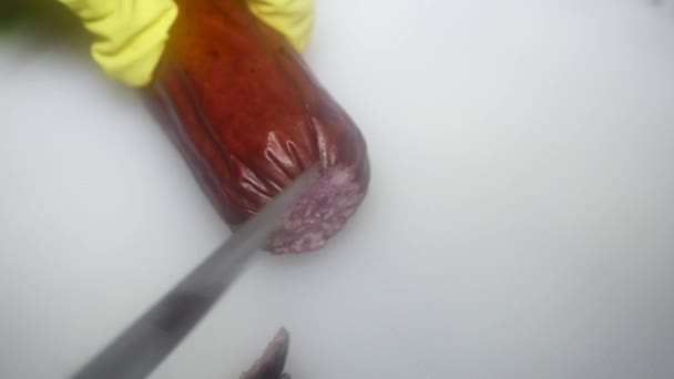 Hand Knife Cuts Sausage White Cutting Board — Video