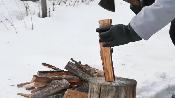 Hand Black Glove Cuts Log Snowy Yard Slow Motion — стоковое видео