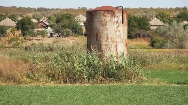 Old Rusty Soviet Water Tank Background Rural Houses — Stock Video