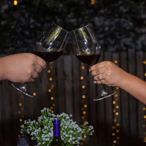 Marriage proposal followed by toasts, drinks, lights, ring