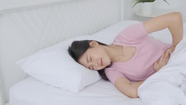 Young Asian Woman Lying Bed Pain Stomach Bowel Disease Constipation — Stock Video