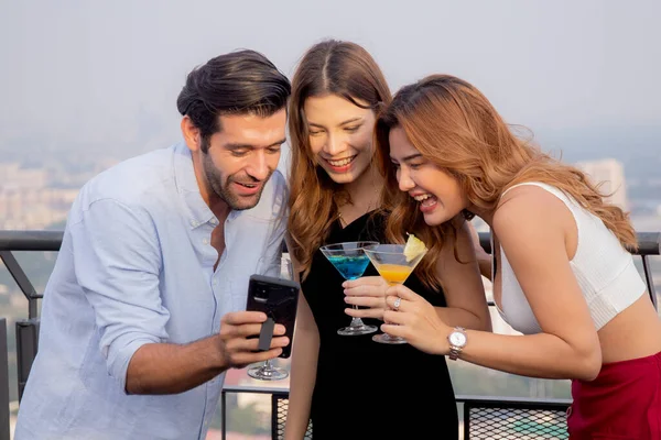 Group friends holding cocktail and selfie in party at restaurant luxury for celebrate with enjoyment together, society of man and woman meeting and taking a photo with fun, lifestyles concept.