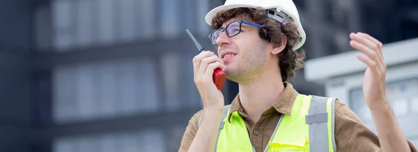 Young Caucasian Man Using Radio Conversation Inspecting While Building Tower — Stok fotoğraf