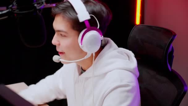 Young Asian Man Wearing Headset Play Video Game Live Streaming — Video