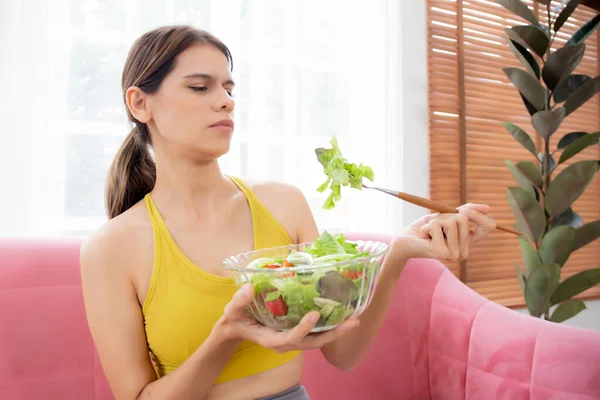 Young Caucasian Woman Sitting Sofa Eating Vegetable Salad While Feeling — Stock Photo, Image