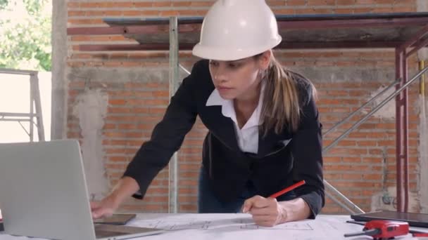 Young Caucasian Architect Woman Looking Laptop Working Drawing Blueprint Planning — Stock video